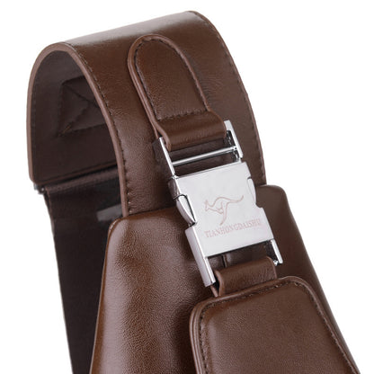 Brown leather suspenders with a silver clasp on a white background