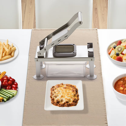 Pasta press on a table with plates of food including lasagna, fruits, and vegetables.