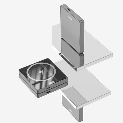 Wireless charging pad with smartphone on a white background