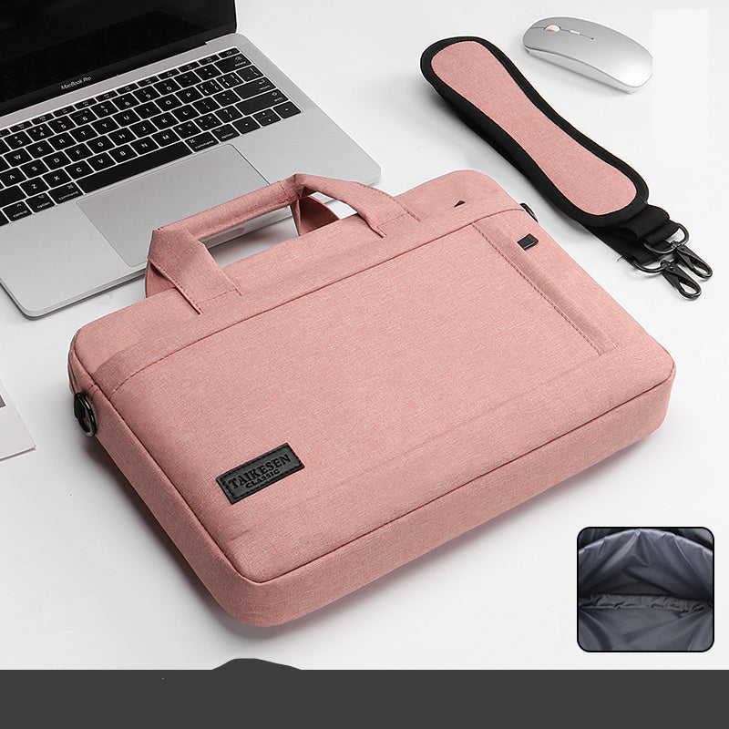 Black laptop bag with a handle and zipper closure, displayed next to a laptop and a mouse, with an inset showing the interior of the bag.