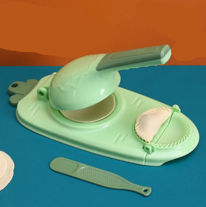 Green kitchen tool with accessories on a blue and orange background