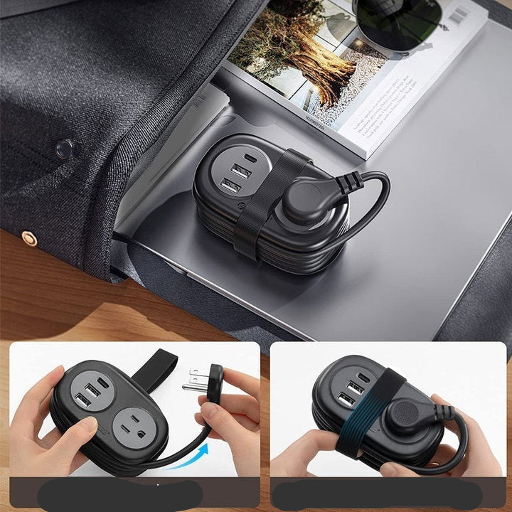 Black power strip with wrap wire design on a desk with a laptop and magazine.