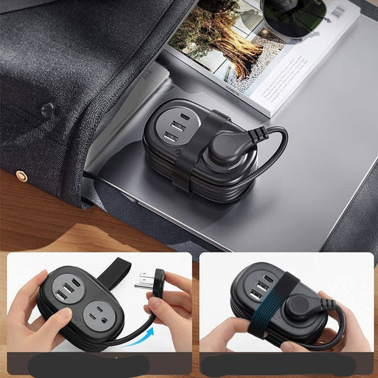 Black power strip with wrap wire design on a desk with a laptop and magazine.