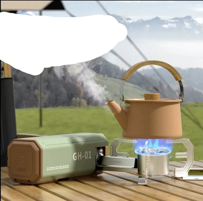 Portable stove with a teapot on a wooden surface outdoors