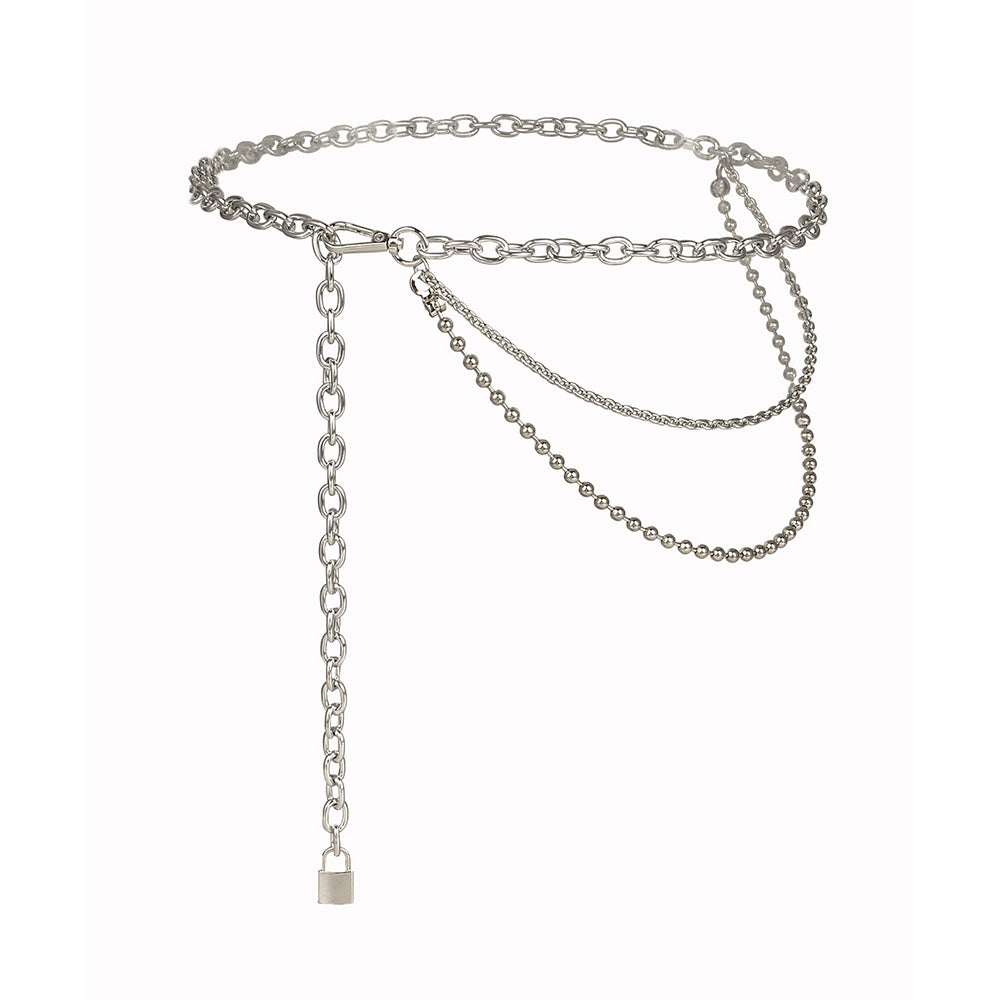 A person wearing a black outfit adorned with a multilayered silver hip hop punk waist chain.