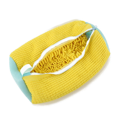 Yellow textured pouch with a white zipper on a white background