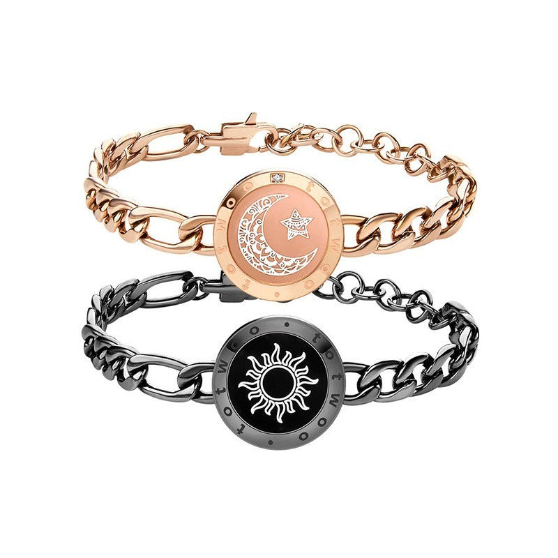 Two chain bracelets with circular emblem designs on a white background