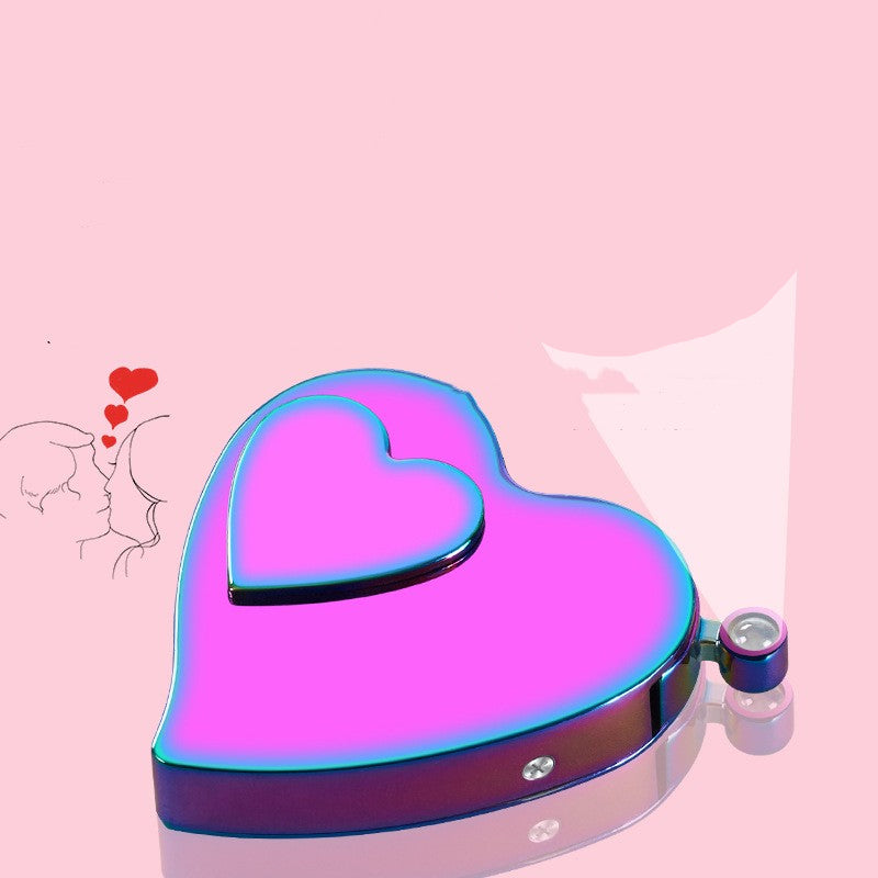Heart-shaped compact mirror with a pink and blue gradient on a pink background