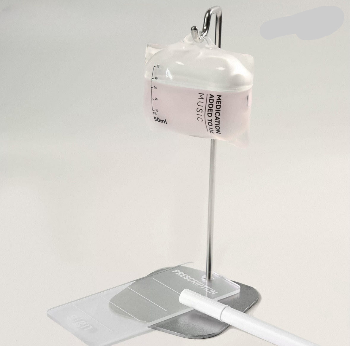 Innovative earphone case designed like a medical vial with a stand on a white background.