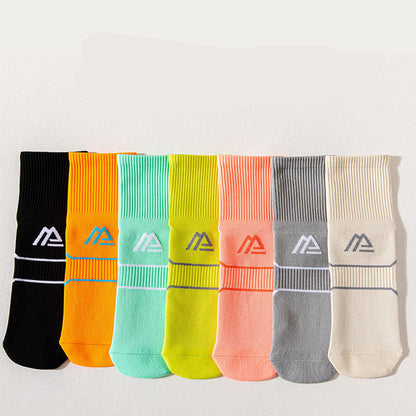 A collection of seven pairs of compression stockings for women in various solid colors, designed for sports and fitness activities.