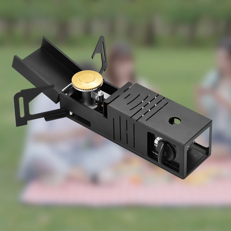 Portable camping stove with blurred people in the background
