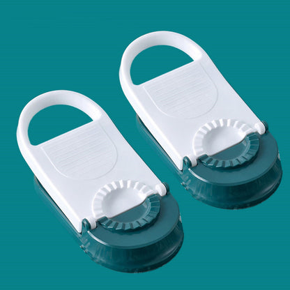 Two white and green kitchen tools on a teal background