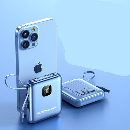 100W power bank with smartphone on a blue background