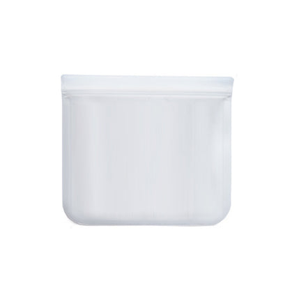 Clear plastic food storage bags of various sizes containing food items, placed in a refrigerator.
