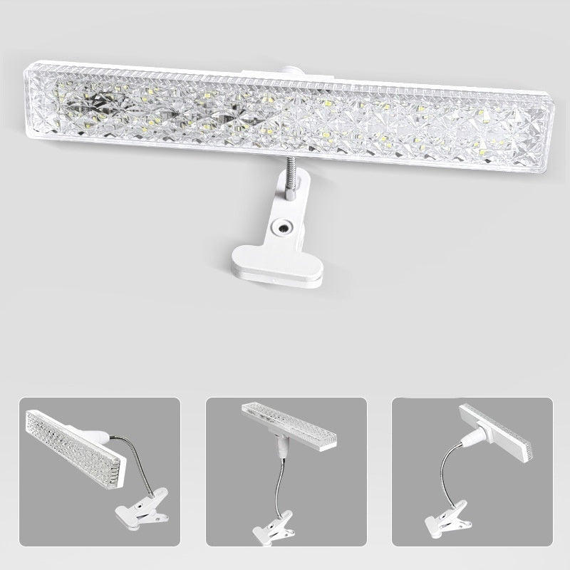 Clip-on light with 360-degree rotation feature on a gray background