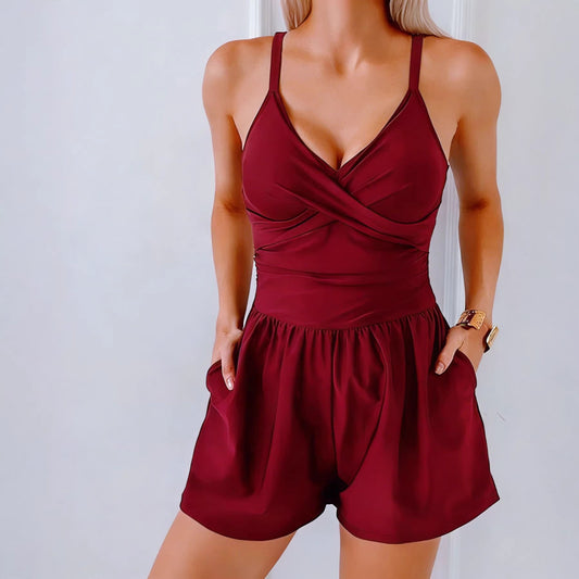 Red romper worn by a person against a plain background