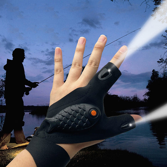 Black glove with a flashlight held by a person, fishing scene in the background