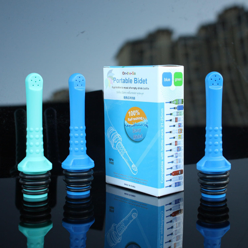 Blue portable bidet attachments with packaging on a reflective surface