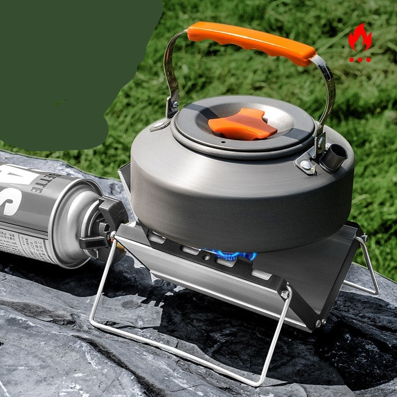 Camping stove with a kettle on a natural background