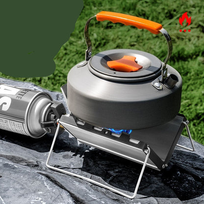 Camping stove with a kettle on a natural background