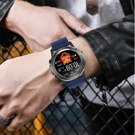 Smartwatch with a blue strap on a wrist, displayed against a blurred background.