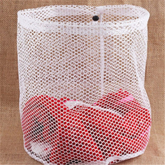 Red underwear in a mesh laundry bag on a brown background