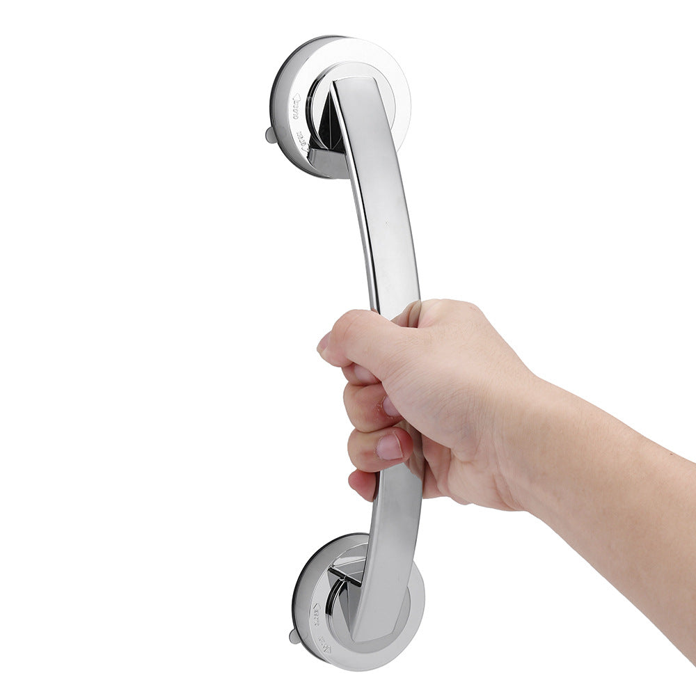 Hand holding a chrome grab bar against a white background