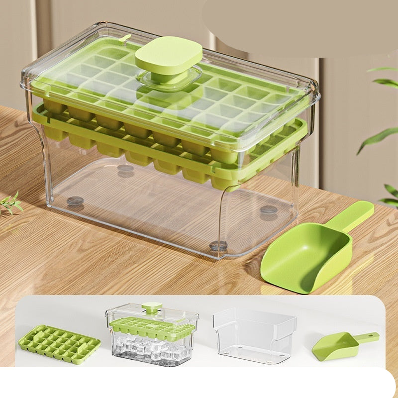 Green and clear ice cube tray with scoop on a wooden surface