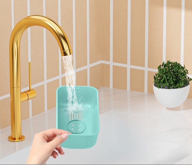 Teal compress with gold faucet in a bathroom setting