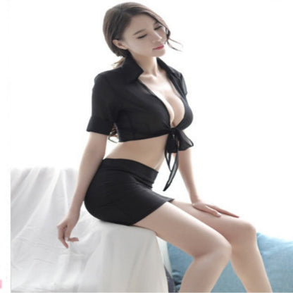 Woman wearing a black outfit sitting on a white couch.