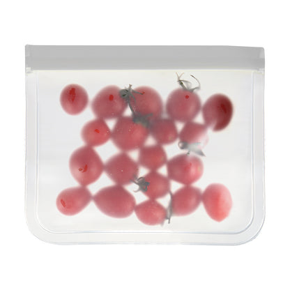 Clear plastic bag with red berries and a gray object inside on a white background