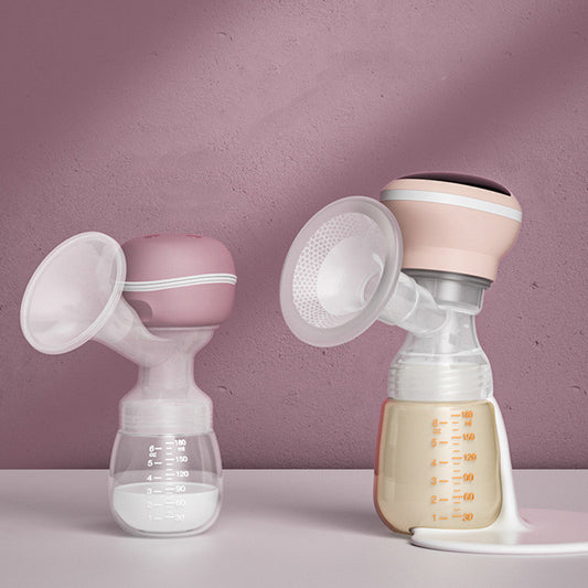 Two breast pumps with bottles on a light purple background
