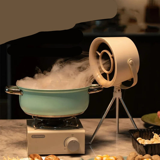 Desktop extractor with USB power supply and adjustable gears in use.