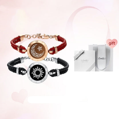 Two bracelets with sun and moon designs on a white background, featuring a gift box.