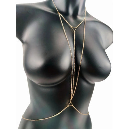 Gold chain body jewelry on a black mannequin