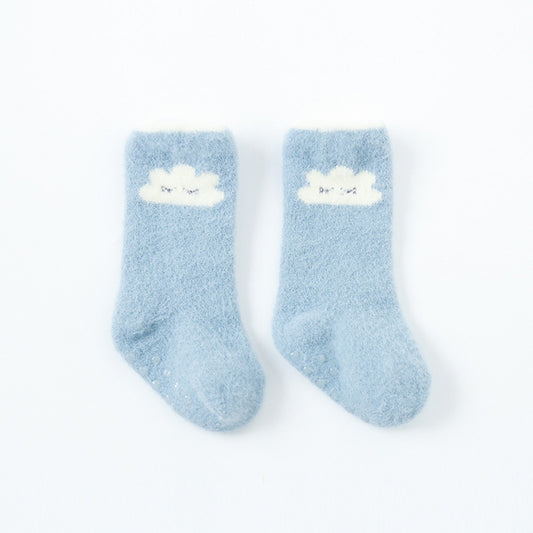 Pair of light blue socks with cloud designs on a white background