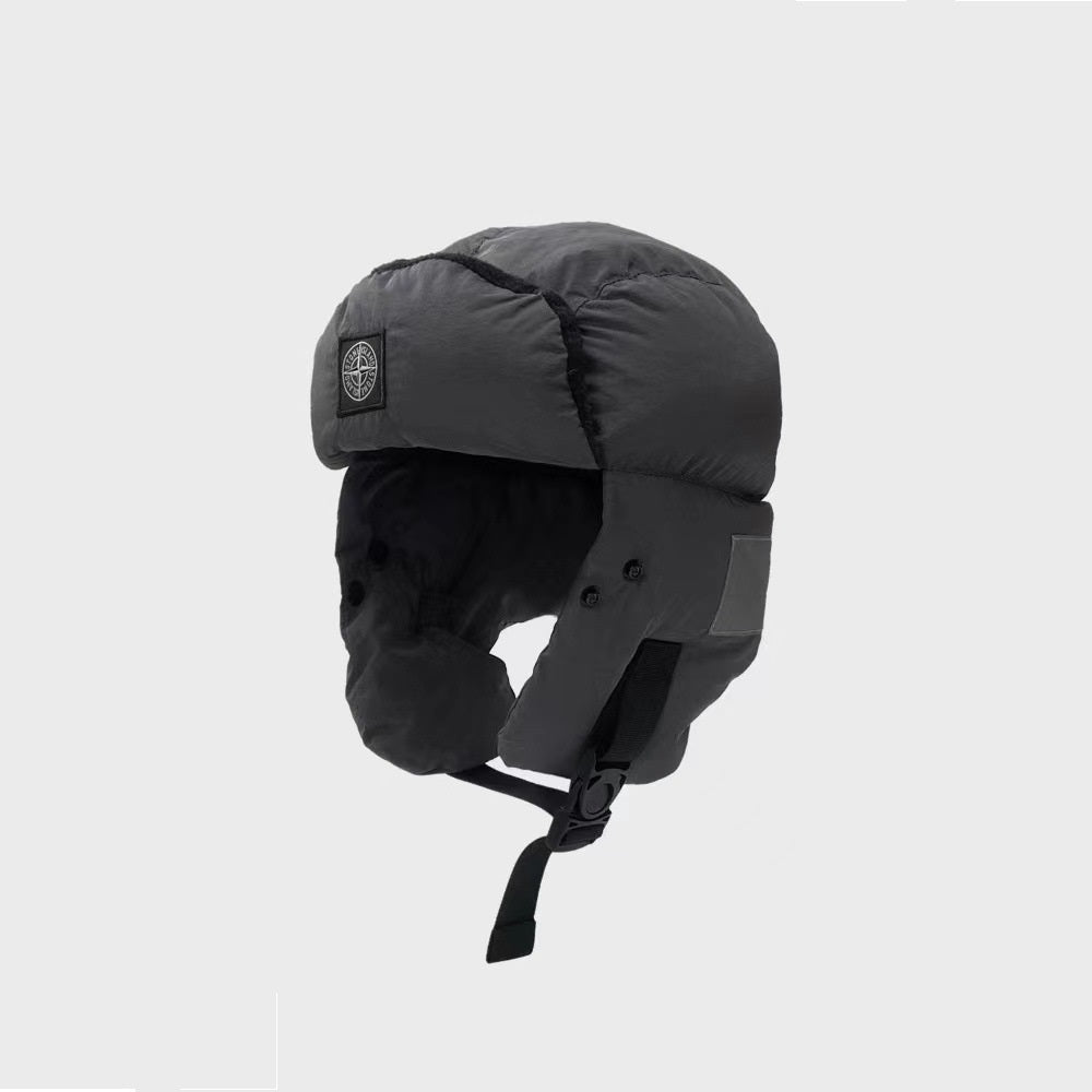 Black winter helmet with a brand logo on a light gray background