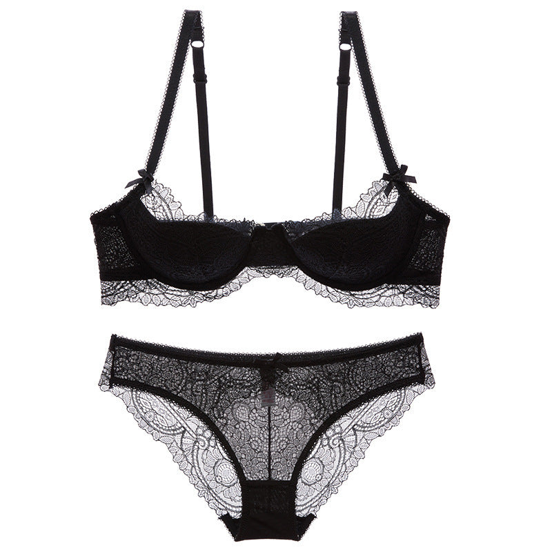Black lace lingerie set with suspenders on a white background
