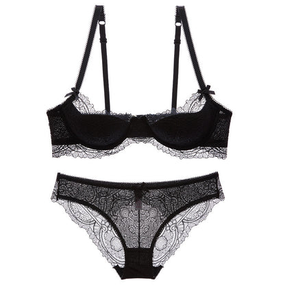 Black lace lingerie set with suspenders on a white background