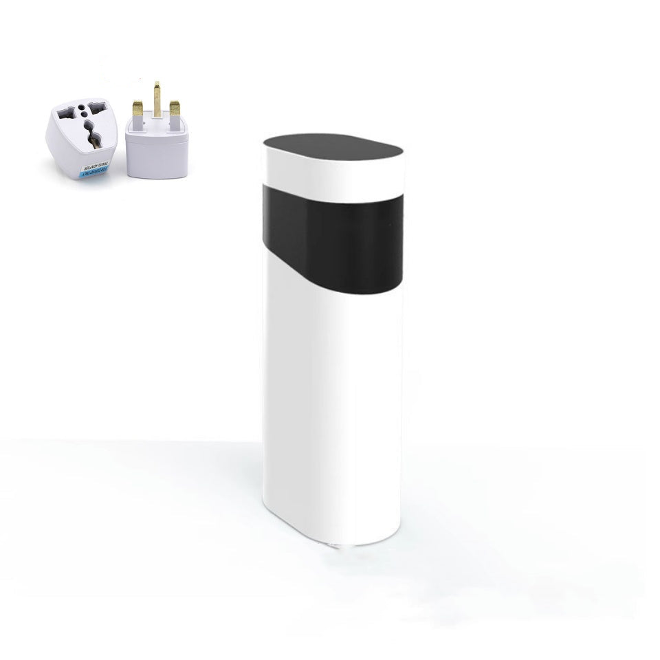 White cylindrical device with black top on a white background, with UK plug adapter on the left.