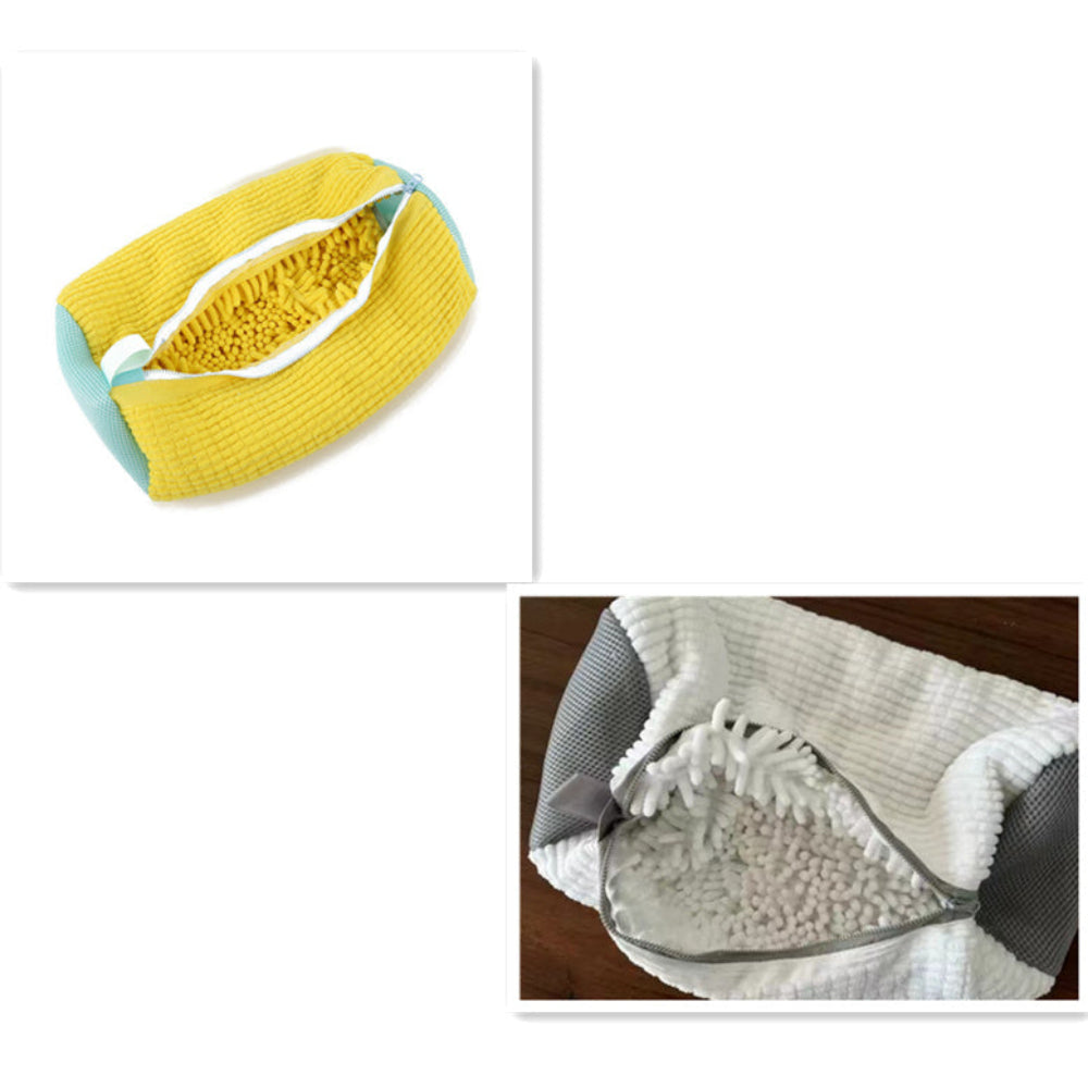 A shoe being washed in a yellow laundry bag with a grey zipper, placed in a washing machine.