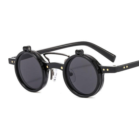 Black round sunglasses with metallic accents on a white background