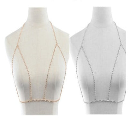 Two white crop tops with beige stitching on mannequins against a white background.