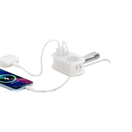 White power strip with flat plug design on a wooden surface, showing space efficiency.