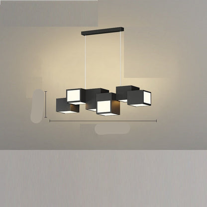 A modern black ceiling-mounted pendant light with multiple square-shaped灯heads hanging over a dining table in a contemporary room setting.