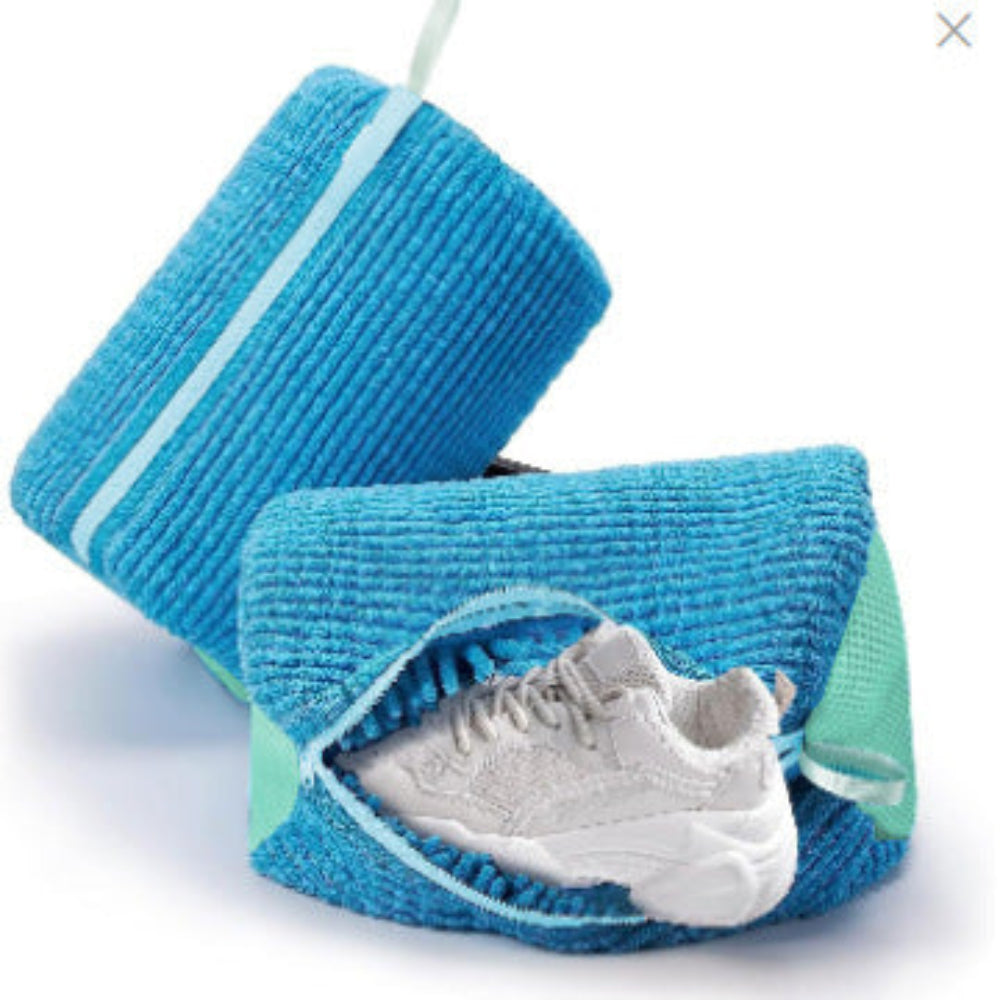 A gray and blue striped shoe bag with a zipper closure and a small white and blue label attached to it.