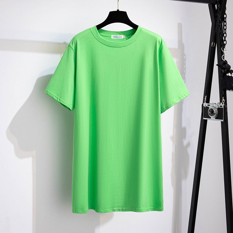A selection of short-sleeved t-shirts in various solid colors, displayed on hangers in a row.