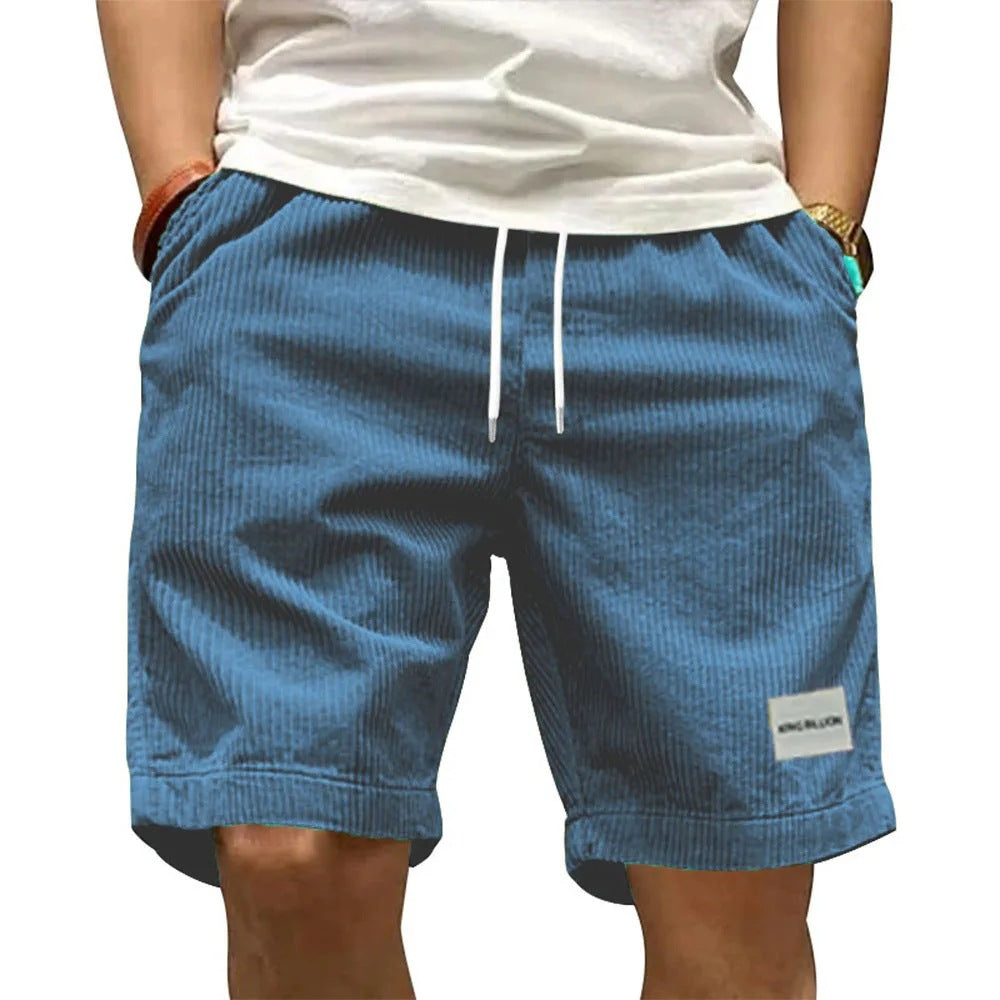 A collection of men's casual shorts in various colors including beige, black, blue, green, khaki, and more, featuring a mid-waist rise and a straight leg cut.