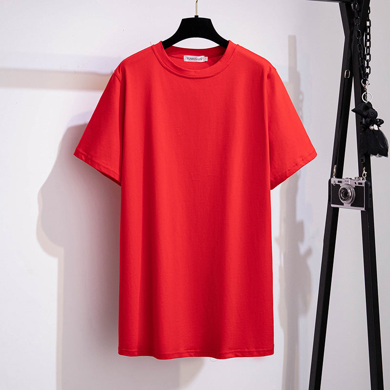 A selection of short-sleeved t-shirts in various solid colors, displayed on hangers in a row.