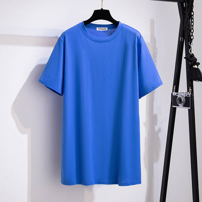 A selection of short-sleeved t-shirts in various solid colors, displayed on hangers in a row.